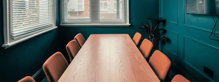 feat-img_a-convenient-story-by-andrea-baker_conference-room-table-chairs