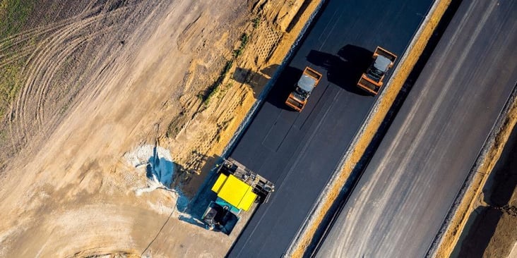 feat-img_accountability-vs-blame_trucks-in-construction